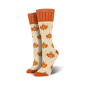 Pair of cream crew socks with orange maple leaf pattern. Orange ribbed cuff.