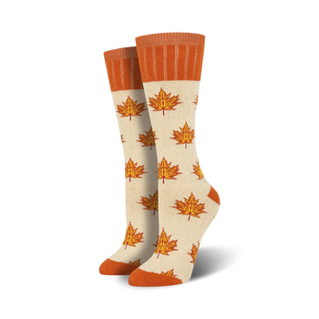 off-white boot socks featuring a maple leaf pattern in orange with an orange cuff at the top. perfect for women who love the outdoors.  
