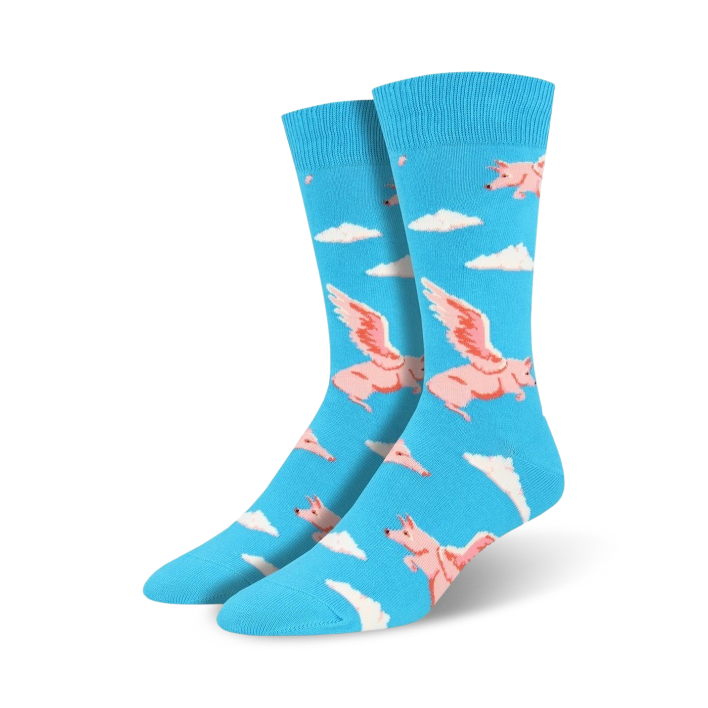 Pair of blue crew socks featuring a fun pattern of pink winged pigs flying above white clouds.