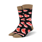 Pair of black crew socks with a repeating pattern of red steak images. Tan cuff detail.