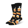 Pair of black crew socks with a repeating pattern of amber whiskey glasses and decanters. 
