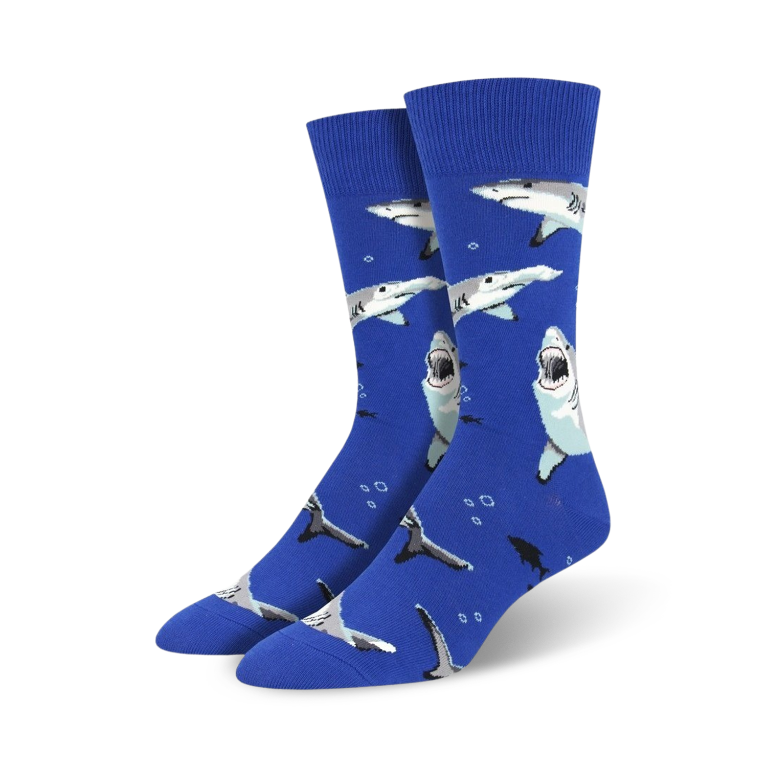 Lifestyle photo showing Shark Chum socks on a person's feet, cuffed at the ankles. Black socks against a colorful background.
