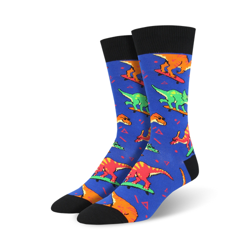 A pair of blue crew socks with a fun pattern of colorful dinosaurs skateboarding.  The socks have black cuffs and a 90s-inspired design.