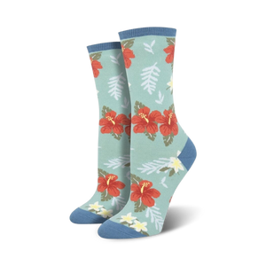 red and orange hibiscus flower pattern on mint green background with blue top. crew length socks for women.  