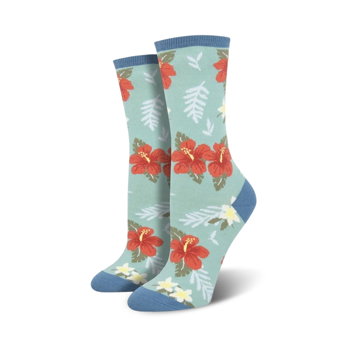 red and orange hibiscus flower pattern on mint green background with blue top. crew length socks for women.  