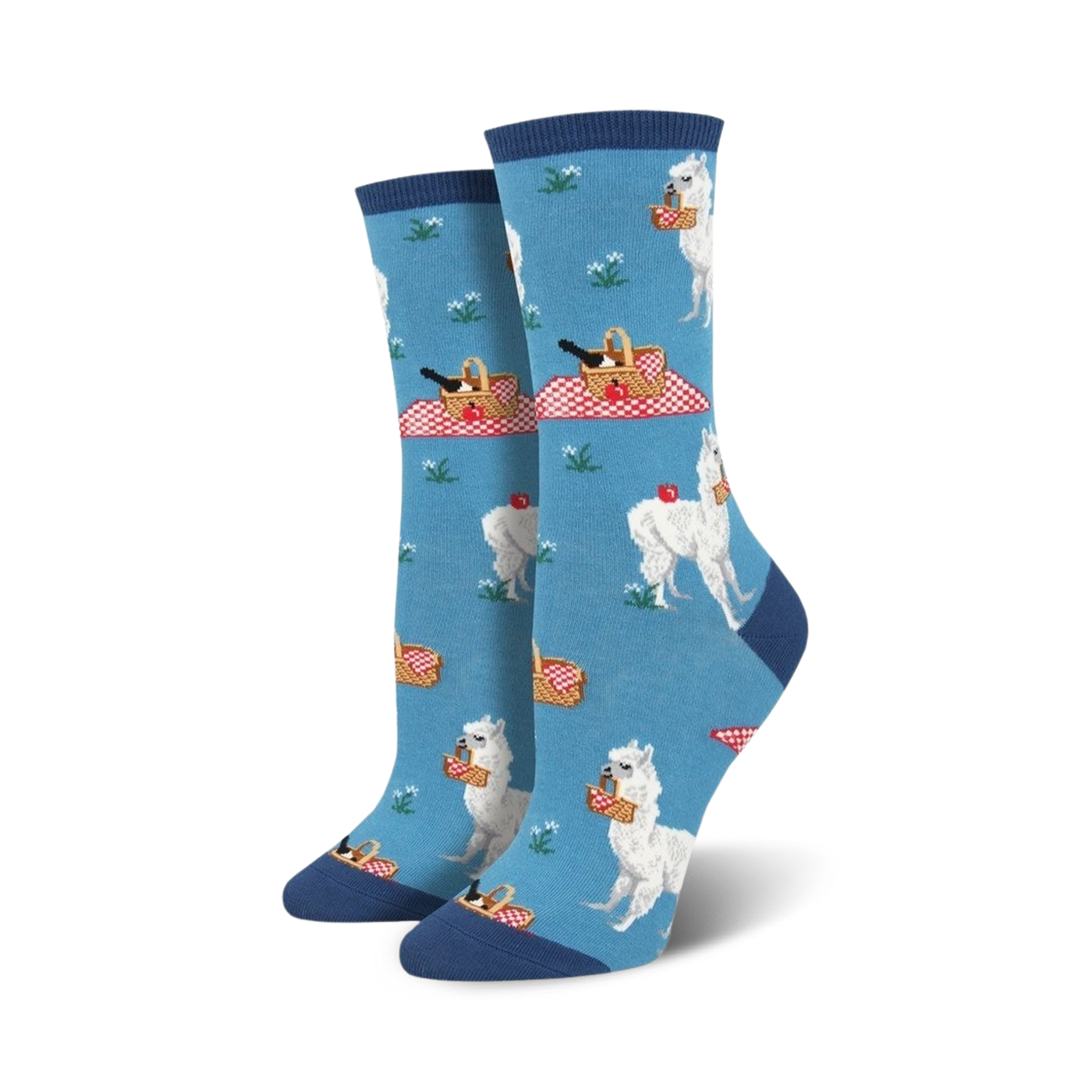 Pair of women's crew socks in blue and green; features white alpacas enjoying picnics with red picnic baskets and apples.