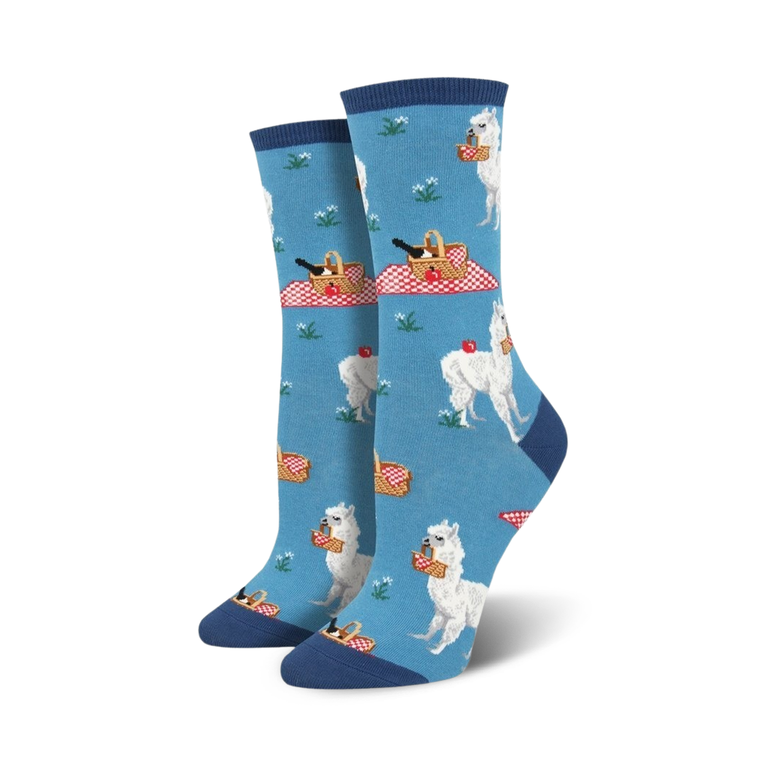 Pair of women's crew socks in blue and green; features white alpacas enjoying picnics with red picnic baskets and apples.
