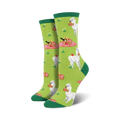 Lifestyle shot of a person's feet wearing the green Alpaca Lunch socks.