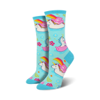 Crew socks in light blue featuring unicorns, Care Bears, and rainbows on inflatable swans. Pink, white, and rainbow accents on a pastel background.