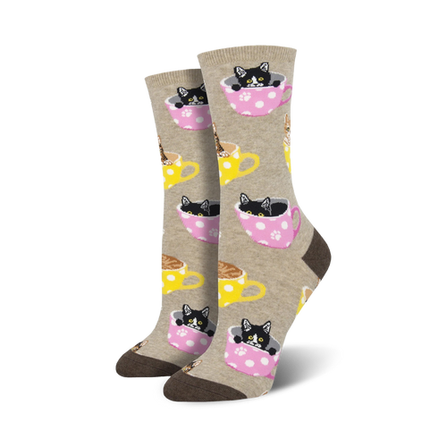 Crew socks in beige, pink & teal featuring black & brown kittens inside polka-dotted teacups.