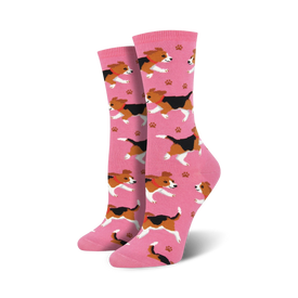pink crew socks with a pattern of cartoon beagles wearing red collars. scattered black paw prints.  