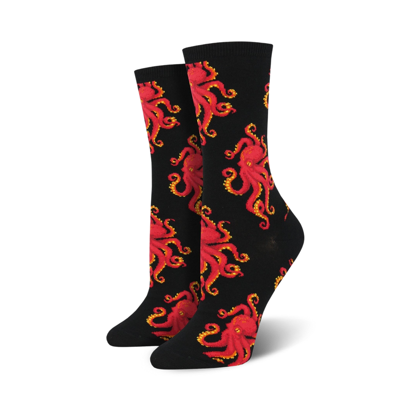 Pair of crew socks with a red octopus pattern on a black background. 