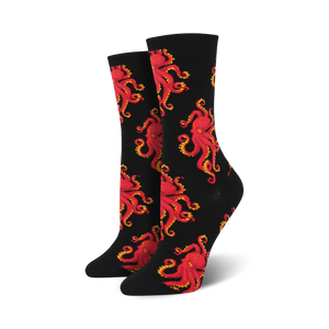 black crew socks covered in an allover pattern of red octopuses with yellow eyes and orange suckers. 