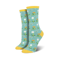 Pair of crew socks, teal background with white dandelions and yellow accents. Yellow cuff.
