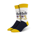 Pair of crew socks; white background with Modelo beer logo in gold, red, and blue; navy blue and yellow accents.
