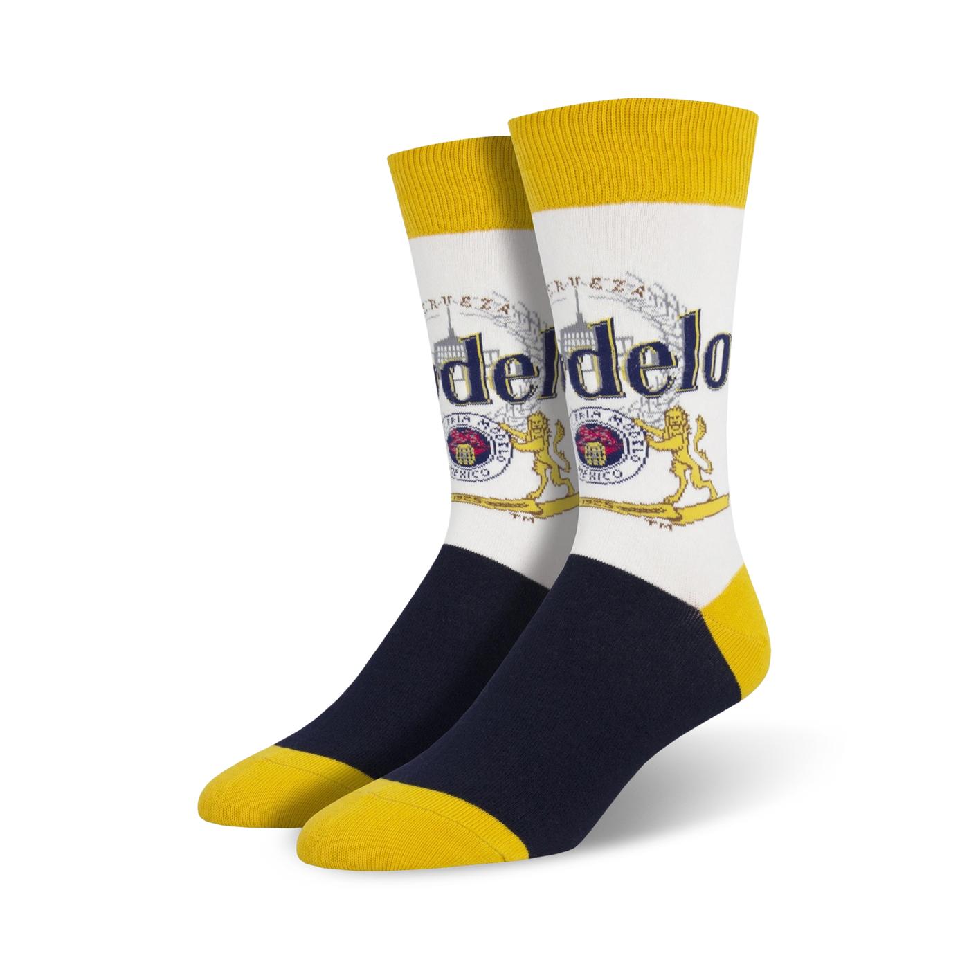 Pair of crew socks; white background with Modelo beer logo in gold, red, and blue; navy blue and yellow accents.