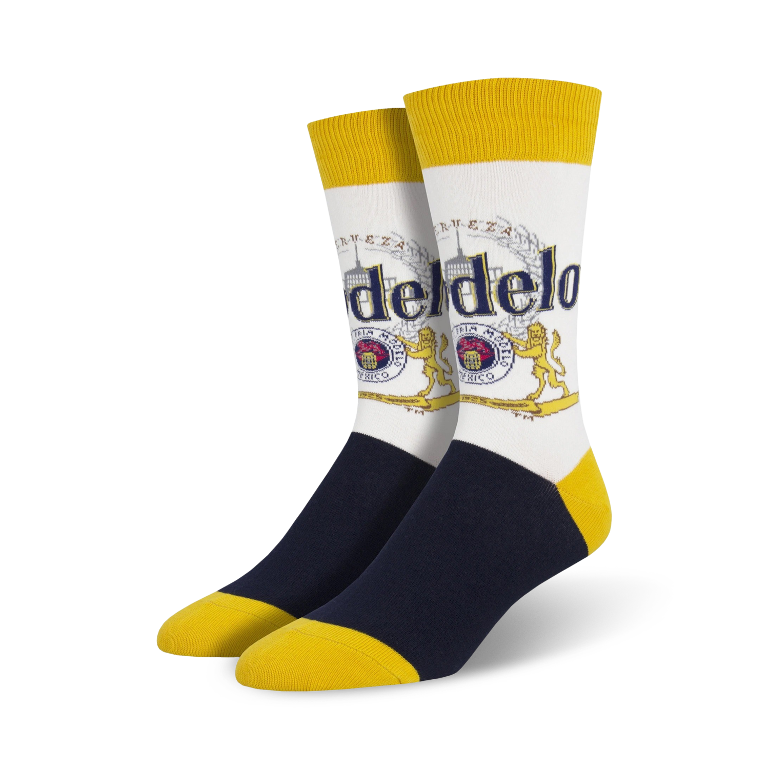 Pair of crew socks; white background with Modelo beer logo in gold, red, and blue; navy blue and yellow accents.