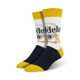 white crew socks with blue toe and heel and yellow top and bottom. pattern of modelo logo with text "modelo especial" and "cerveza fina".   