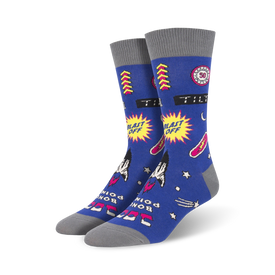 blue crew socks with rockets, stars, and "blast off" and "tilt" patterns. gray toes and heels.  