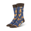 A pair of crew socks with a navy blue background and a pattern of golden retrievers. The socks have brown cuffs.