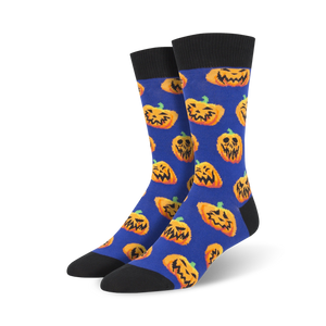 mens crew socks feature all-over pattern with cartoon pumpkin faces with various expressions.  