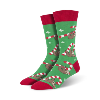 mens green christmas crew socks with pattern of sloths wearing santa hats and holding candy canes.   