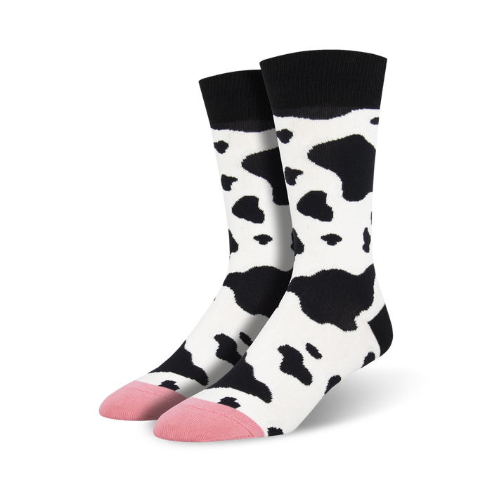 black and white cow print crew socks with pink toes and heels. sock theme is cow.   }}