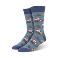 Crew socks in blue and green, featuring a repeating pattern of otters wearing Santa hats and holding presents.