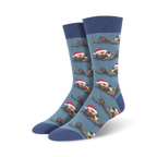 Crew socks in blue and green, featuring a repeating pattern of otters wearing Santa hats and holding presents.