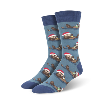 blue crew socks with cartoon otters wearing santa hats and holding presents, perfect for men's christmas attire.  