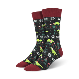men's santasaurus rex crew socks: black with green dinosaurs wearing santa hats, carrying presents, and red top with white snow flakes   