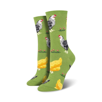 Pair of women's crew socks, green and blue options, featuring a repeating pattern of black and white chickens and yellow chicks on a grassy field.