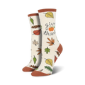 Cream-colored crew socks with autumn leaves, a small pumpkin, and the text 'Give Thanks'.