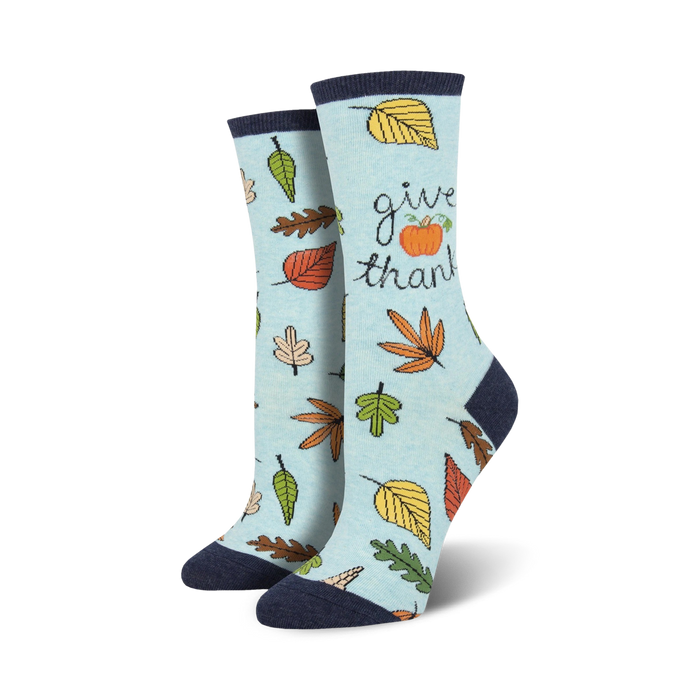 womens crew socks in light blue with fall leaves, pumpkin, and 