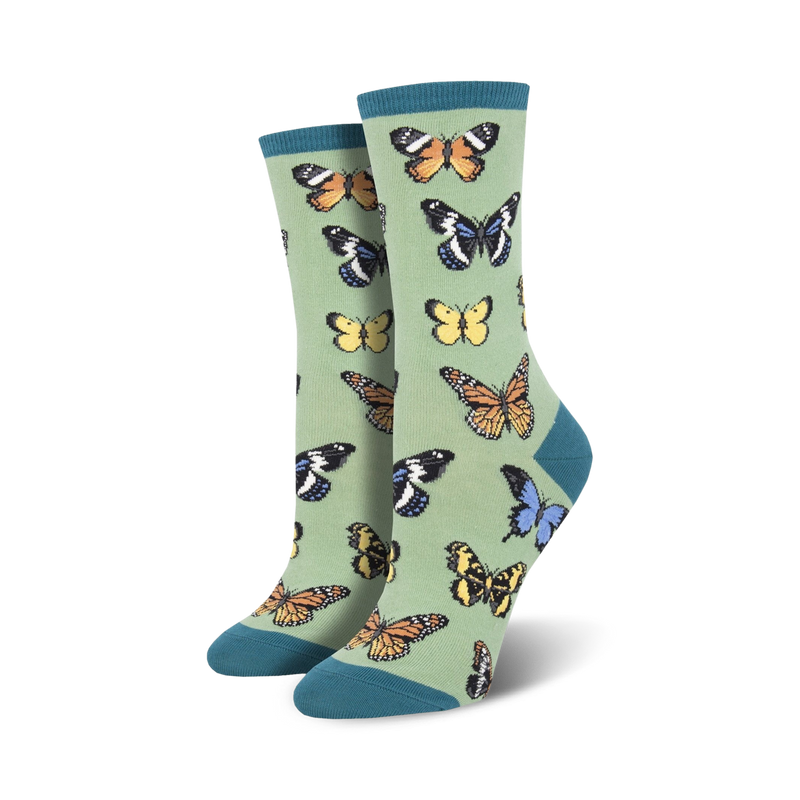 Pair of women's crew socks in sage green with a colorful butterfly pattern. 