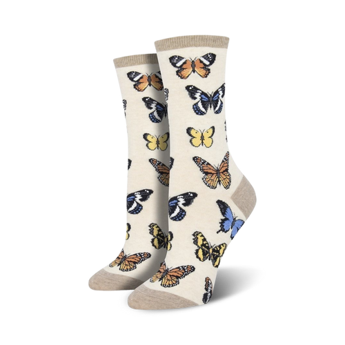 Close-up of women's crew socks in beige featuring a butterfly pattern. 