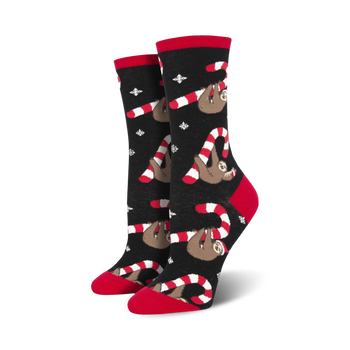black crew socks feature red and white candy cane pattern with sloths in santa hats. christmas. women's.  