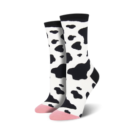 mid-calf socks white with irregular black spots varying in size. pink toe and heel. women's crew length cow patterned. 