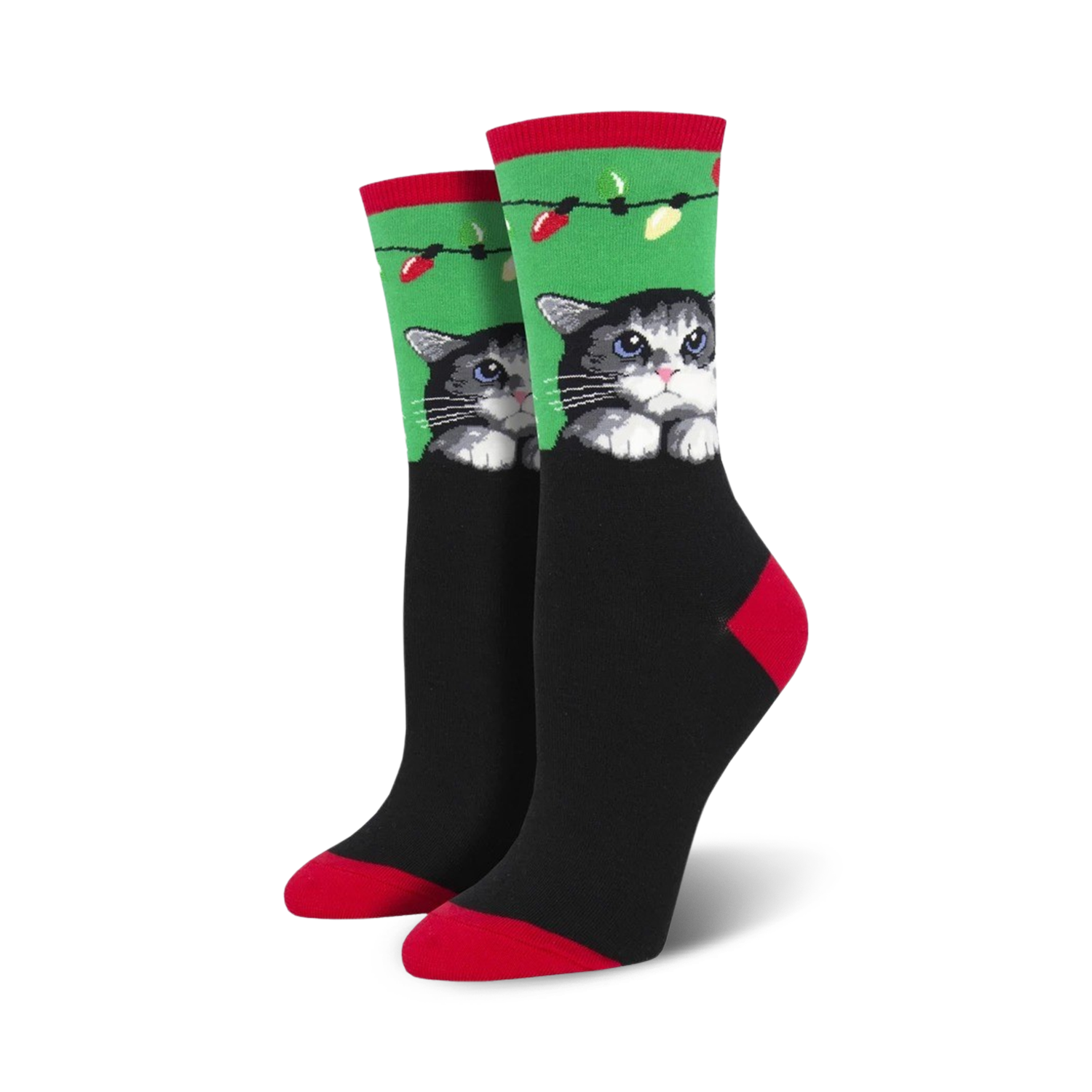 Pair of women's crew socks. Black background, green and red accents, cute gray cat peeking over the top with holiday lights.
