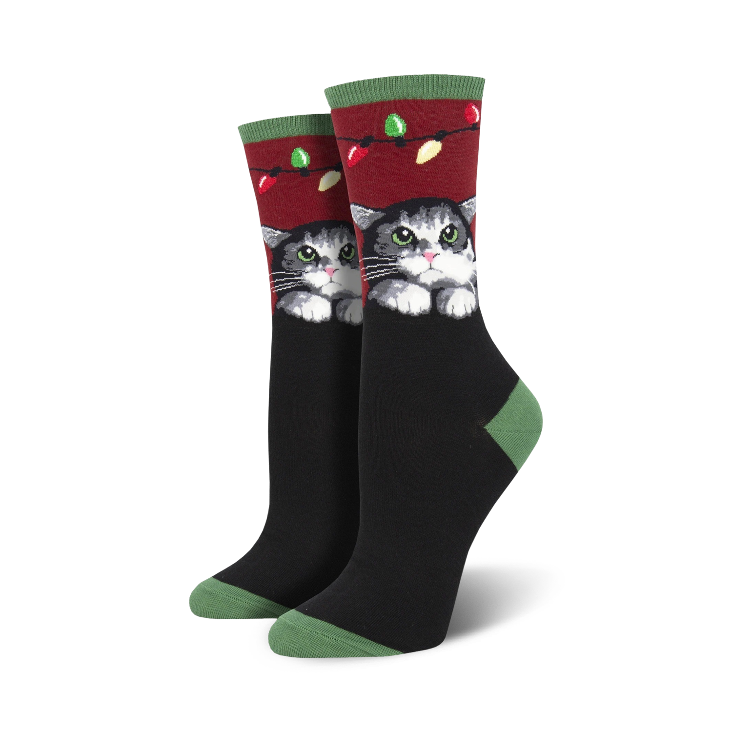 Lifestyle shot showing the socks on a person's feet, highlighting the festive design and cat illustration.