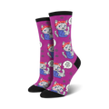 Lifestyle shot showing the purple version of the 'We Can Mew It' socks on a model's feet.