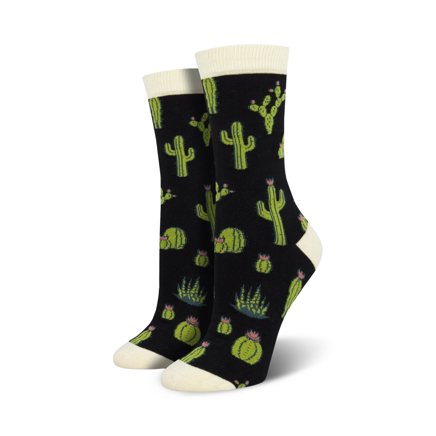 A pair of women's crew socks with a cactus design. The socks are black with green cacti, succulents, and pink flowers.
