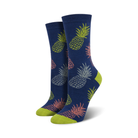 blue crew socks with an allover print of pink, green, and yellow pineapples with green leaves. pineapple theme. bamboo pineapple print.   