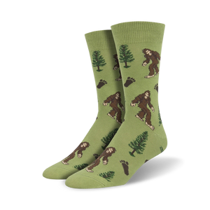 green crew socks with brown bigfoot images and dark brown pine trees, footprints.   