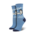 A pair of women's crew socks in light blue with a navy heel and toe. The socks feature a retro illustration of a woman drinking coffee and the text 'Sleep When You're Dead'.