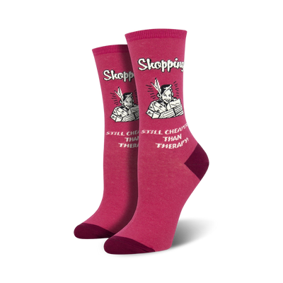 pink crew socks with white text "shopping...still cheaper than therapy" cartoon of a lady with shopping bags  