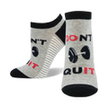 Close-up of gray and black 'Don't Quit, Do It' ankle socks with barbell design.