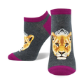 Lifestyle product shot showcasing the grey and magenta 'Queen of the Pride' socks on a model's feet.