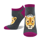 Lifestyle product shot showcasing the grey and magenta 'Queen of the Pride' socks on a model's feet.