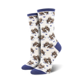 Close-up of a pair of navy-cuffed otter socks against a cream background.